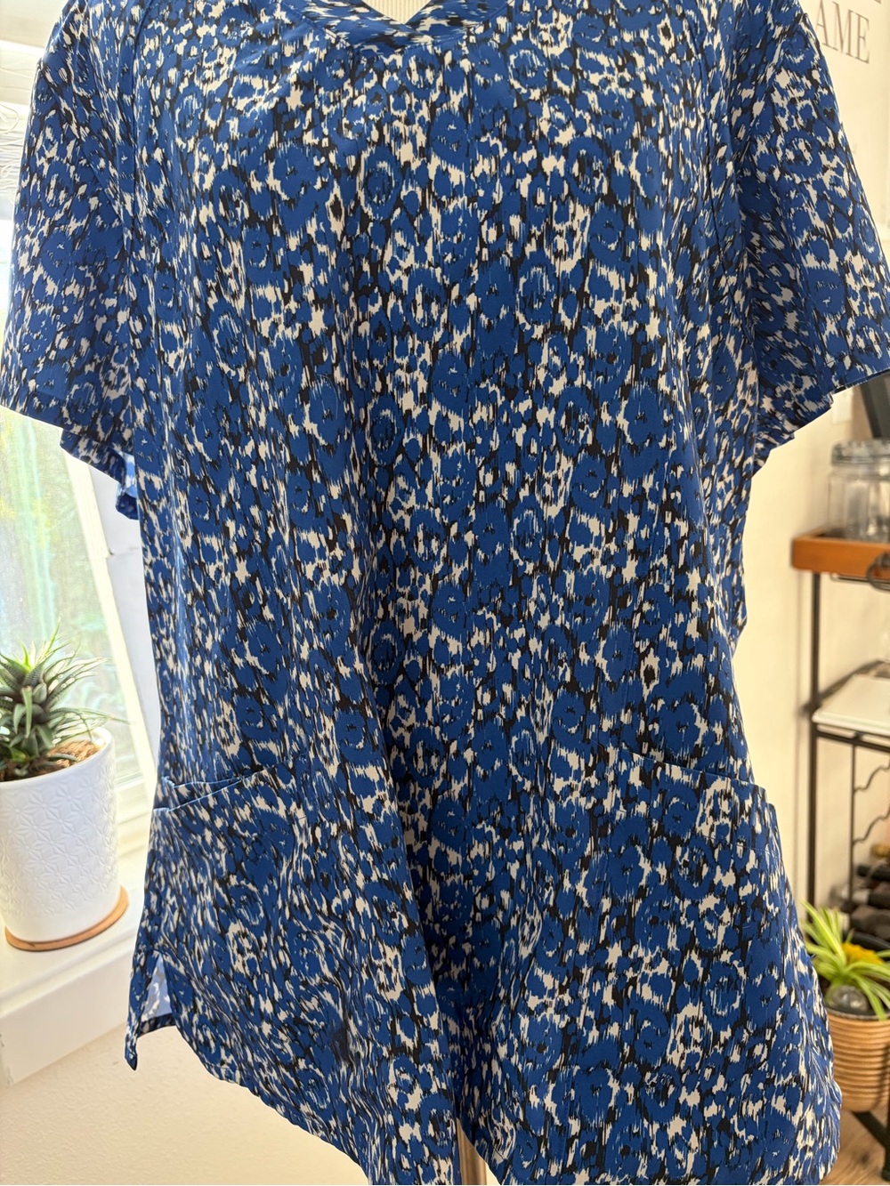Blue Leopard-Print V-Neck Tunic scrub top  with Front Pockets.  Stain resistant